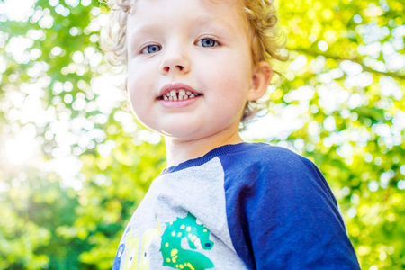 boy on his walk in summer park