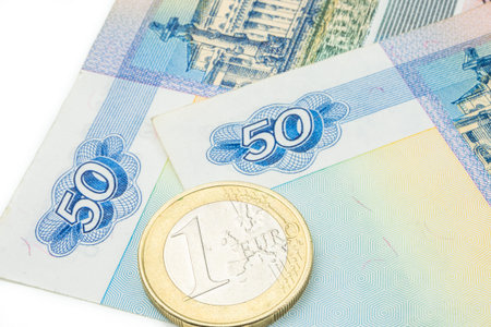 russian ruble banknote and one euro laying on white background
