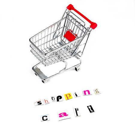 chrome shopping cart with funny letters on white backgroundの写真素材