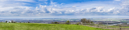 panoramatic view of austrian landscape with wind mills in the backgroundの写真素材