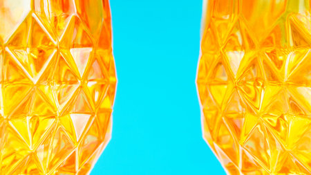 two orange glass forming abstract pattern on blue background with one part defocused