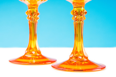 two orange glass on blue and white backgroundの写真素材