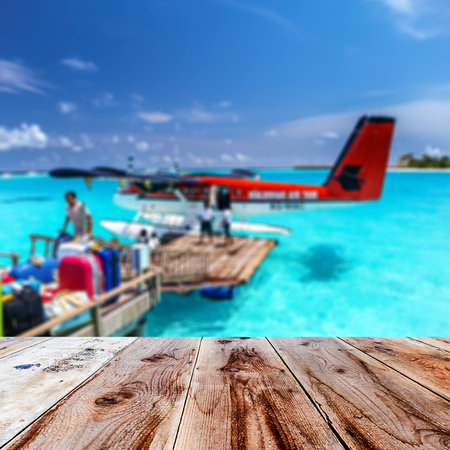 wooden front path with maldives airplanes blurred background