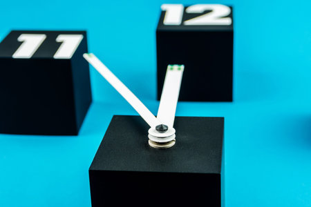 five minutes before twelve with black cubes as digits of big clock on blue background