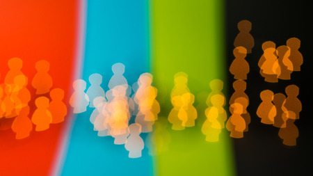 beautiful bokeh made of blurred lights in the form of people icons on multicolored backgroundの写真素材