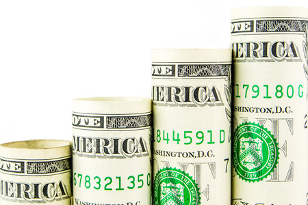 rising steps made of one american dollar banknotes on white bakgroundの写真素材