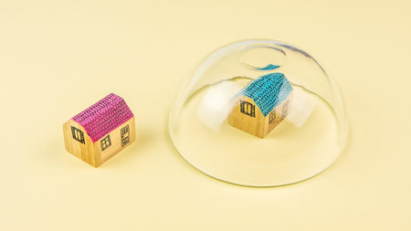 how to protect your house, one miniature wooden house protected and the other one not protected with...