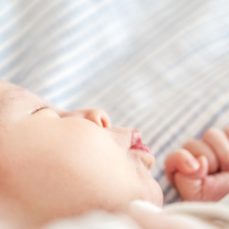 newborn child sleepingの写真素材