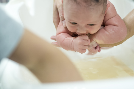 newborn child bathingの写真素材