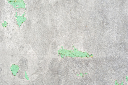 grey metal plate wall with residual green paintの写真素材