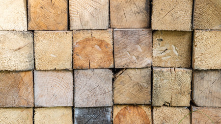 closeup of pile of firewood with regular square form