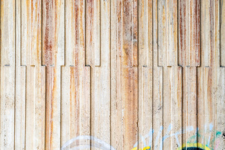 closeup of grey concrete wall with lineal parts, vertical lines