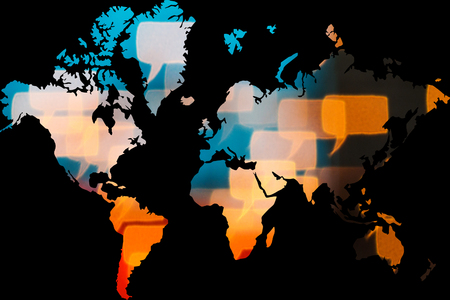 dialogue bubbles shapes forming world map on black backgound with multinational connection worldwide conceptの写真素材