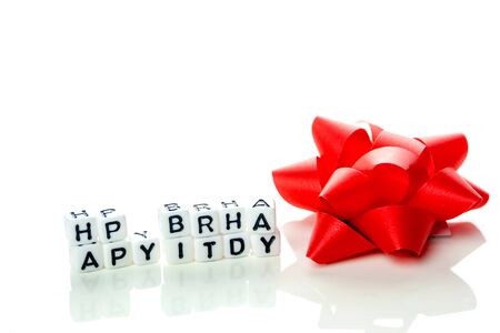 happy birthday special unconventional card made of white cubes with black letters and birthday decorations on white backgroundの写真素材