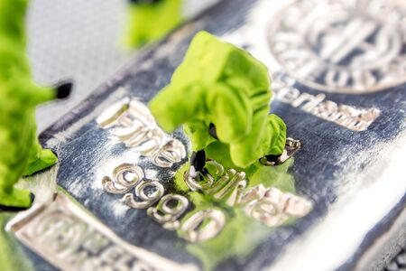 closeup of miniature figurines dressed like members of firemen special team interfering during gas and other chemical accidents with the action monitoring low historical price of silverの写真素材