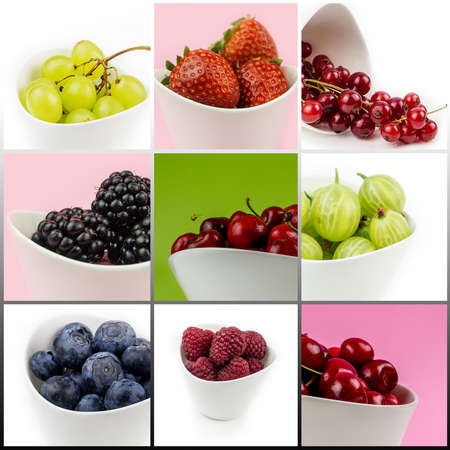 collection of fruit in white ceramic bowls on multicolor background isolated, cherry, strawberry, blackberry, raspberry, bilberry, gooseberry, grape, currantの写真素材