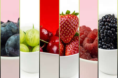 collection of fruit in white ceramic bowls on multicolor background isolated, cherry, strawberry, blackberry, raspberry, bilberryの写真素材