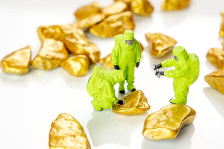 bio hazard special forces miniature figuriens in special green suits making an inspection whether the gold or precious metals is safe and good investmentの写真素材