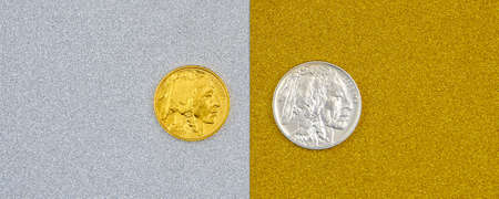 silver and golden american buffalo one ounce coins laying on silver and golden background, image split in two halvesの写真素材