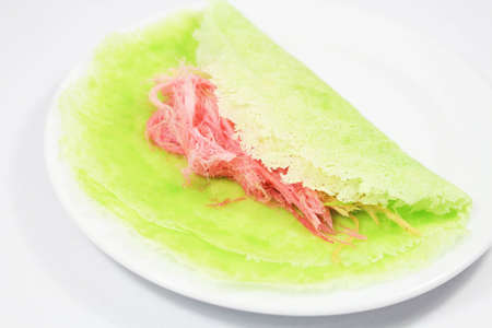 Roti Saimai  Cotton candy  is Thai-style candy floss isolated on whiteの写真素材
