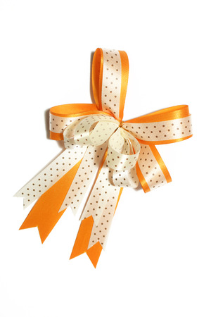 Festive gift ribbon and bow isolated on whiteの写真素材