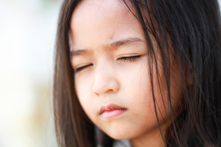 Little girl closed her eyesの写真素材