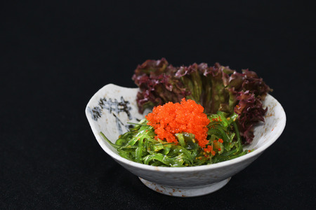 Japanese Cuisine, Seaweed Salad in black bowl on black background.JPGの写真素材