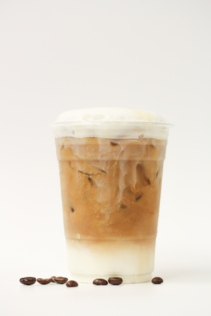 Iced latte in takeaway cup on white backgroundの写真素材