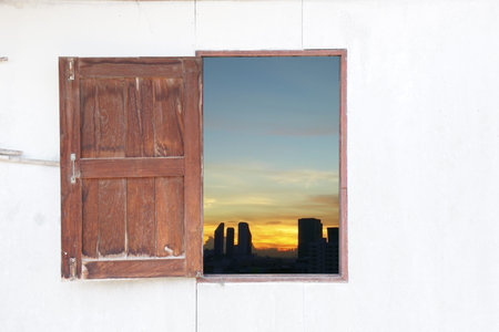 window with sunset town view