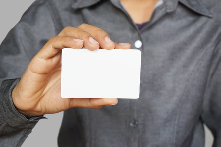 Man holding white business cardの写真素材