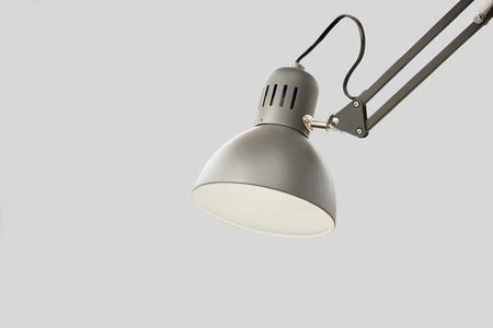 vintage gray desk lamp isolated on gray backgroundの写真素材