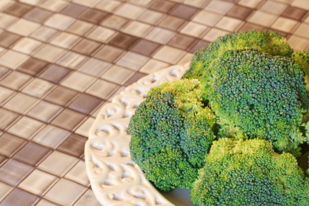 Fresh broccoli on white plate on table  Selective focusの写真素材