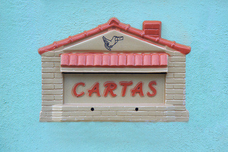Postbox house bird with letter on blue wall, Brazilの写真素材