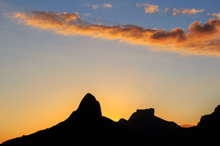 Sunset Lagoon Rodrigo de Freitas (Lagoa), silhouette of mountain Two brothers, Stone of Gavea, Rio de Janeiro, Brazilの写真素材