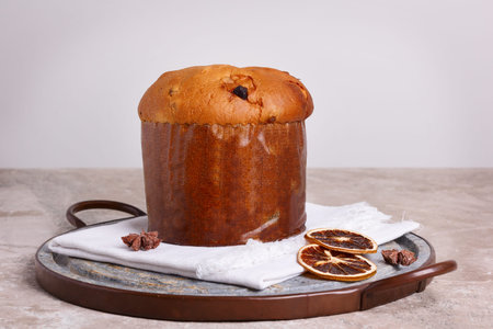 Panettone - sweet bread loaf traditional for Christmas and New Year. Selective focus. Copy space