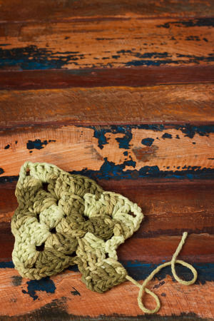 New year decoration with handmade green crochet christmas tree. Selective focus. Copy spaceの写真素材