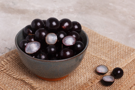 Berry Jaboticaba in bowl on marmory table. Selective focusの写真素材