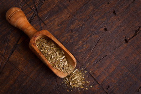 Mate with scoop on wooden background. Selective focusの写真素材