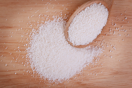 Granulated cassava (tapioca) on wooden background. Selective focusの写真素材