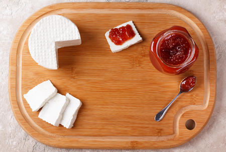 Brazilian dessert Romeo and Juliet, goiabada jam of guava and cheese Minas on wooden board. Selective focus. Copy spaceの写真素材