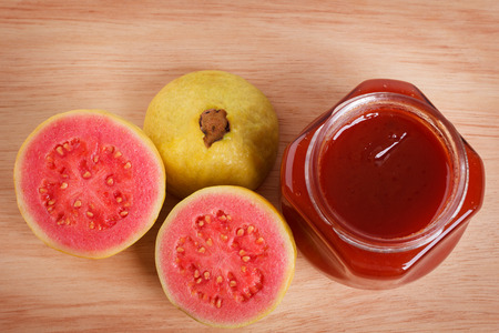 Brazilian dessert goiabada - jam of guava with fresh goiaba on wooden background. Selective focusの写真素材