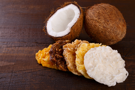Coconut candy cocada of diffferent tastes on wooden background. Selective focus?  Coppy spaceの写真素材
