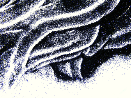 Black glitter sparkle on white background with space for textの写真素材