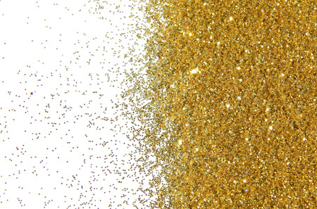 Textured background with golden glitterの写真素材