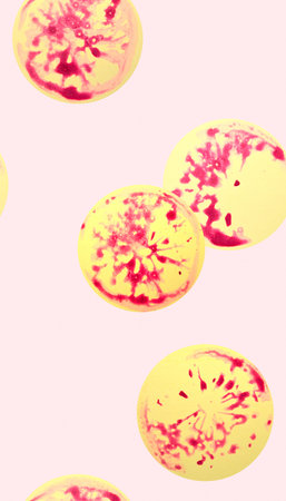Seamless pattern with abstract watercolor orange slices on pink background