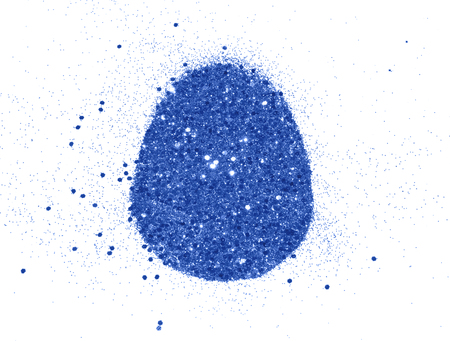 Easter egg of blue glitter on white background, holiday decorationの写真素材