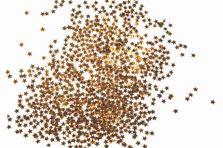 Glittering golden stars on white background