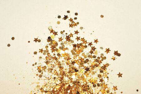 Gold glitter and glittering stars in vintage colorsの写真素材