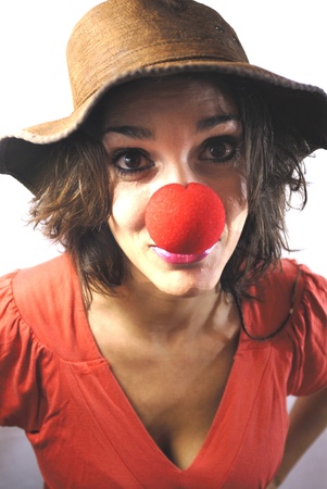 Young girl smiling clown on white backgroundの写真素材