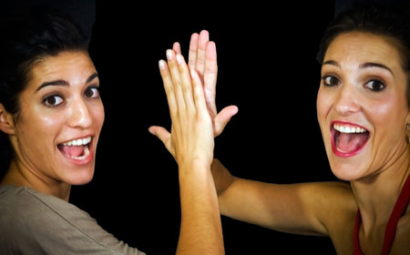 Two beautiful sisters smiling and cheerfulの写真素材